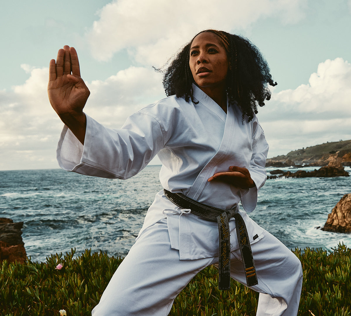 woman training near ocean